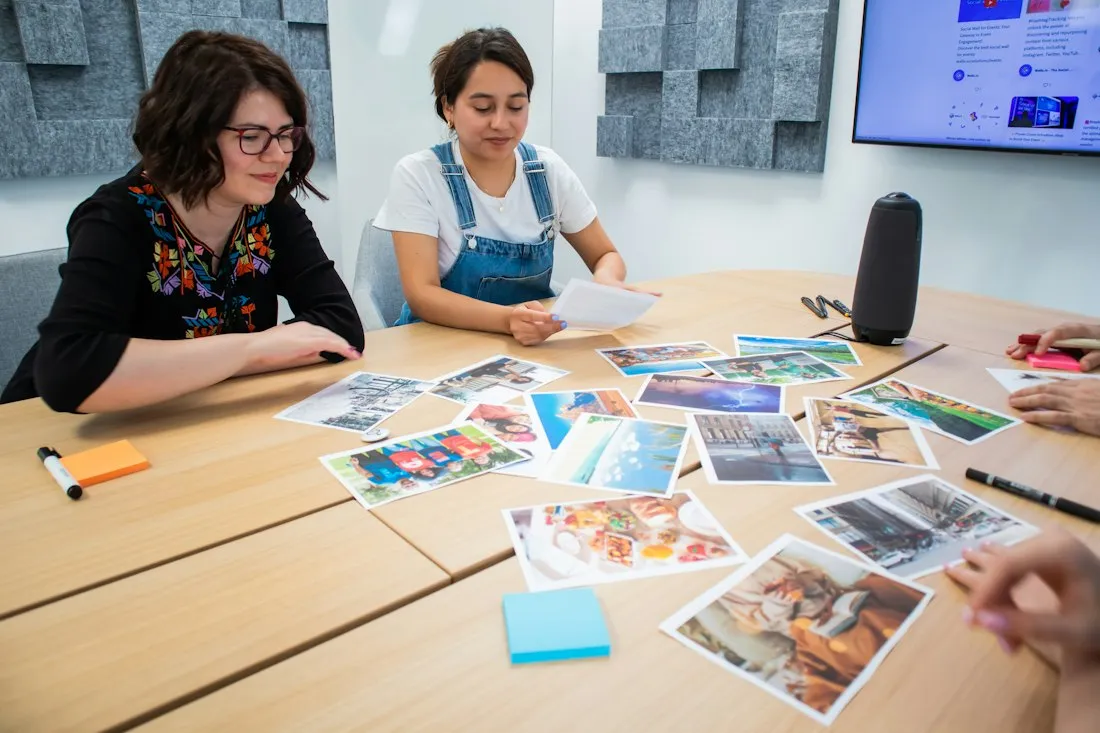 Creative team reviewing printed visuals on a table