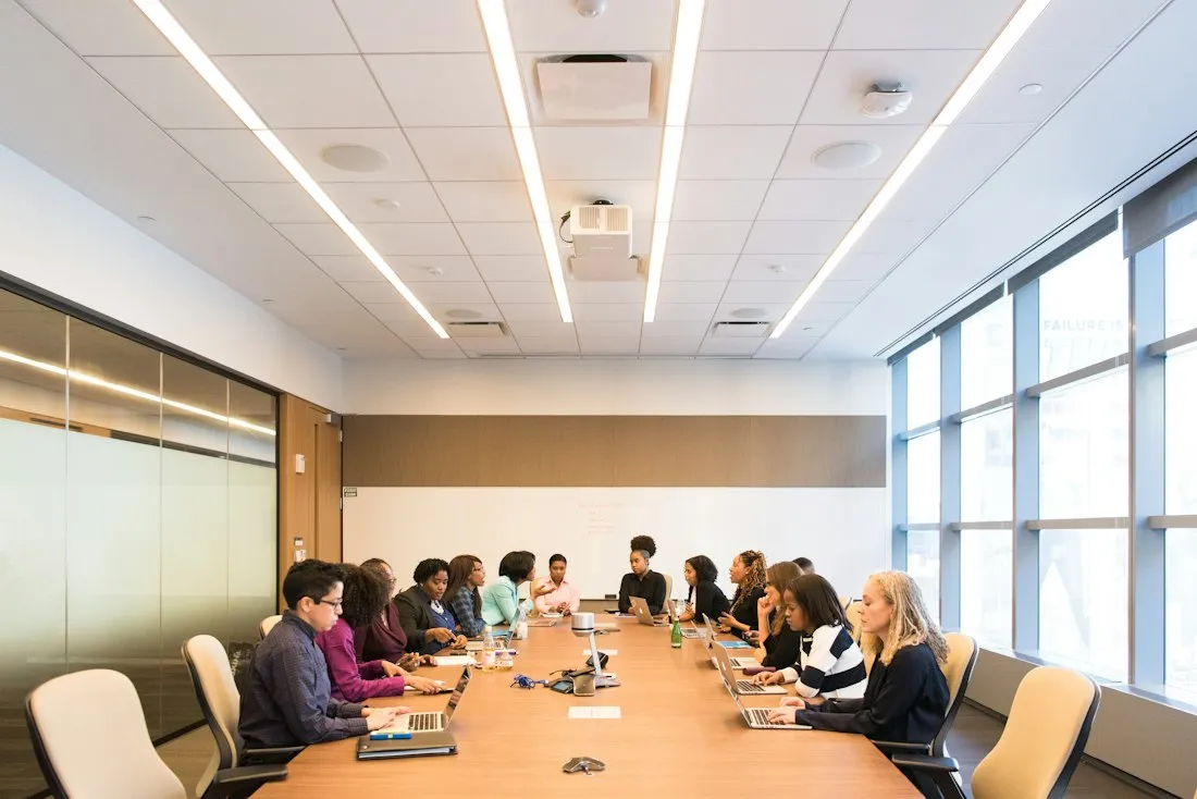 Team meeting around a long boardroom table